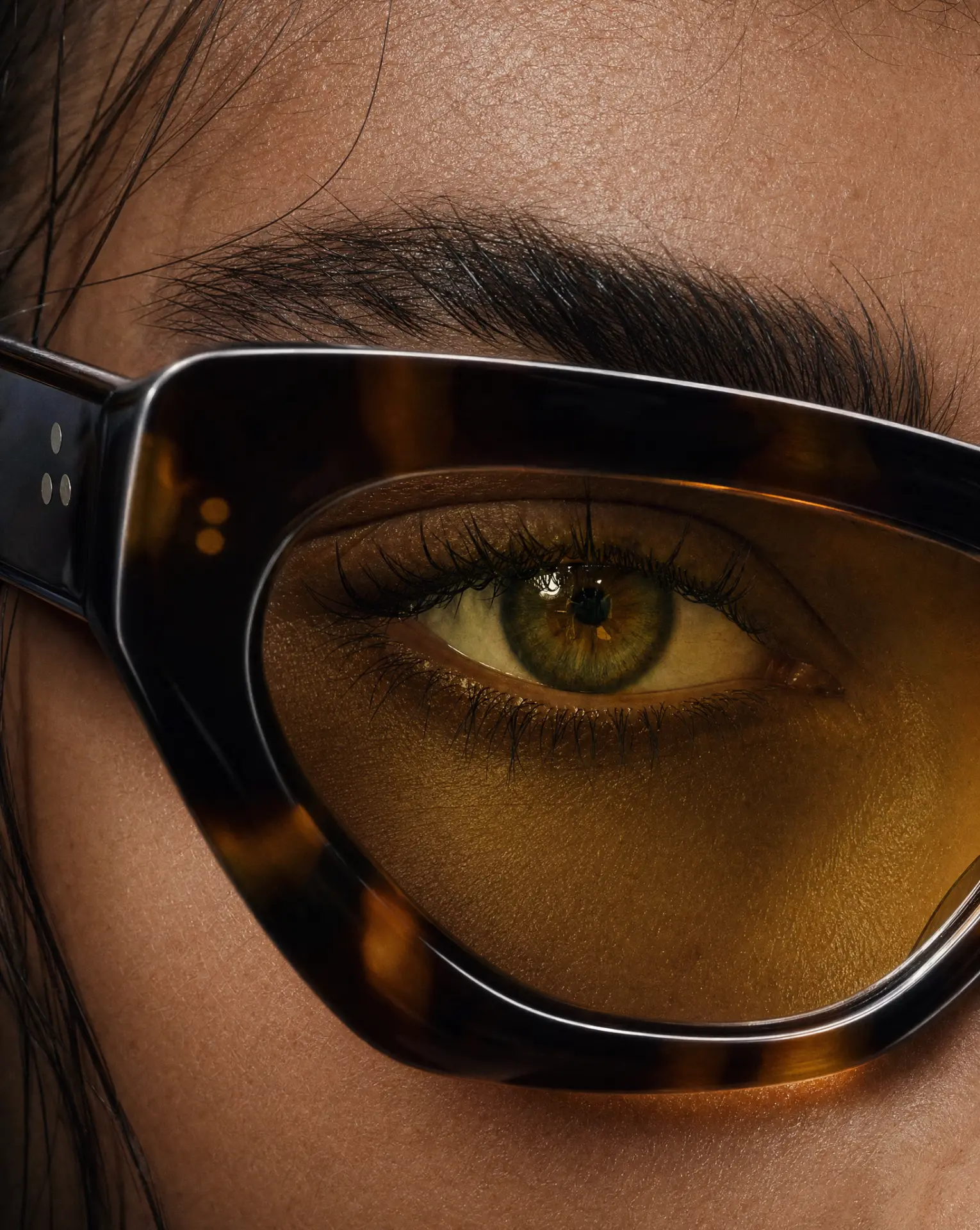 Eyewear — macro eye through tortoiseshell lens